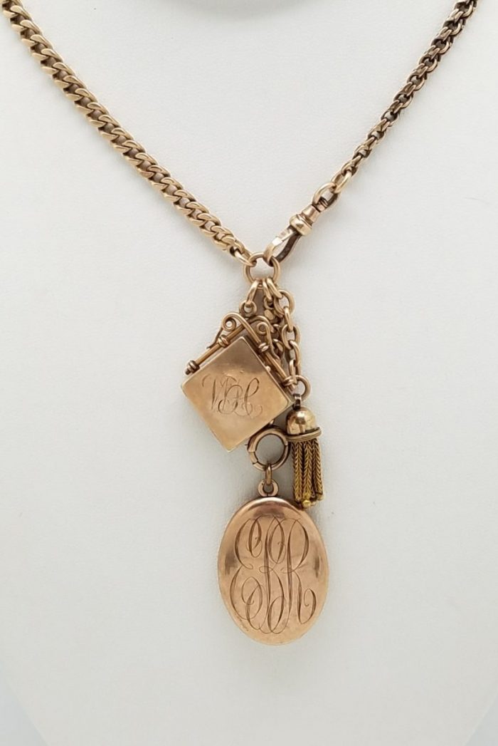 Gold Pocket watch chain with Lockets and tassel.